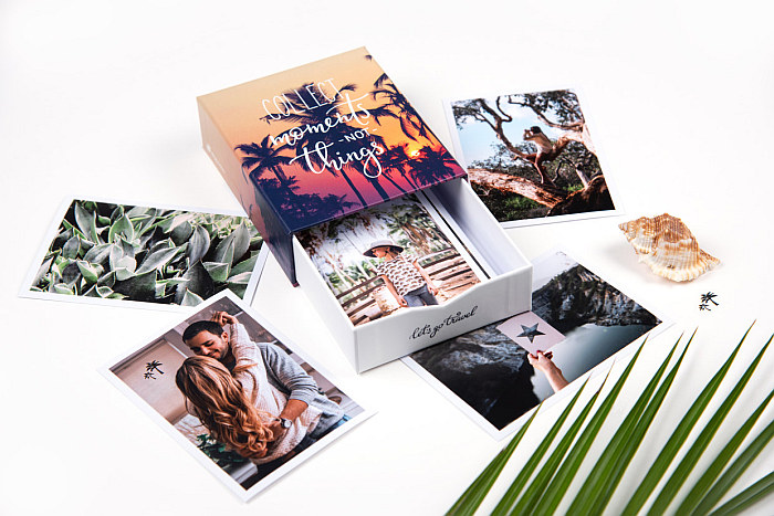 Photo box with vacation-memories, saying "Collect moments, not things"