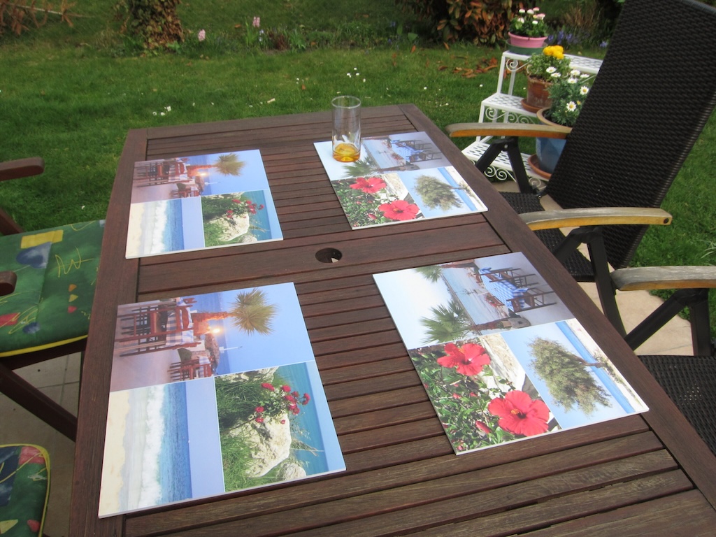 Personalized table sets on a garden table featuring holiday photos
