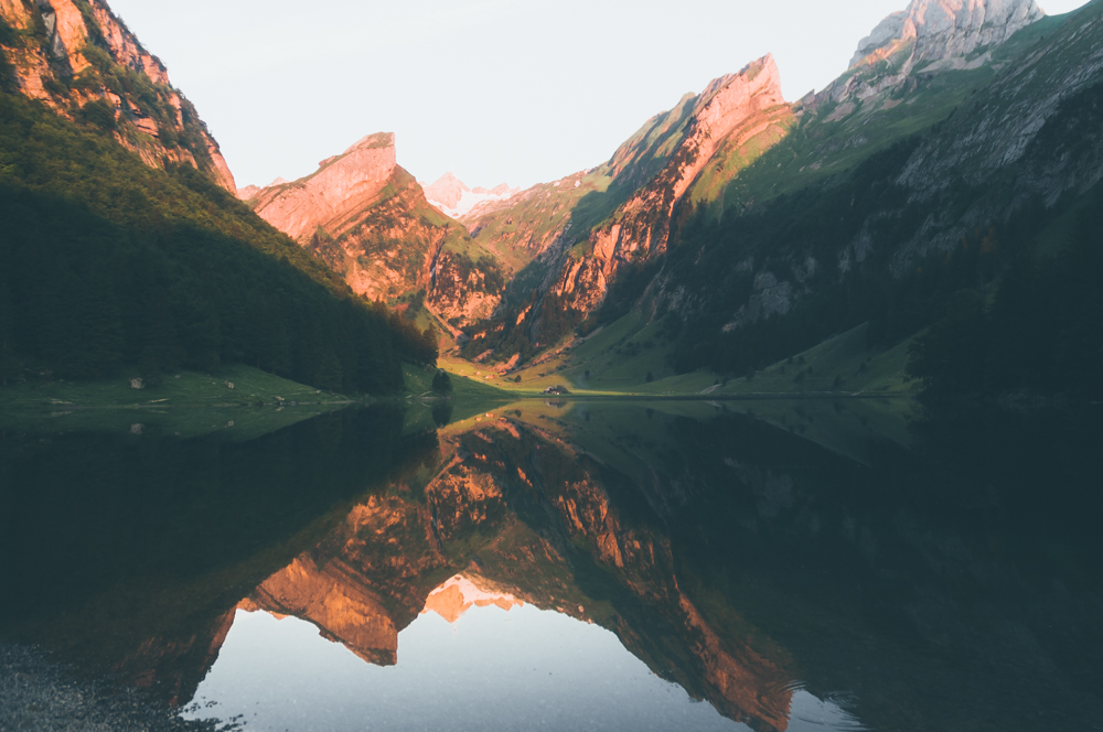Nature photography of Seealpsee with reflecting water surface during sunrise