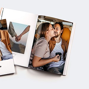 Photobook with a picture of a couple in a campervan next to a picture of holding hands