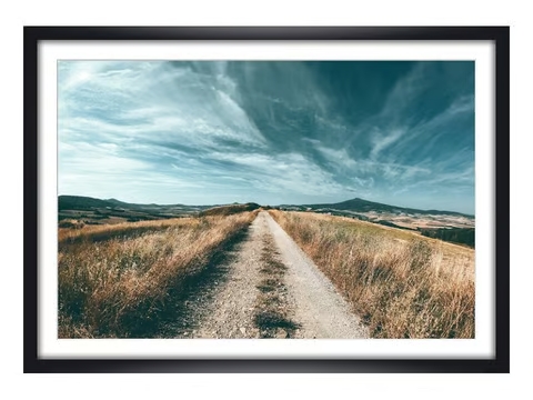 Framed wall art with landscape photo of a dirt road