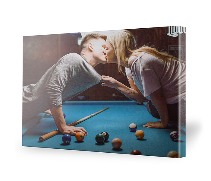 Wall art print of a couple kissing while playing billiards