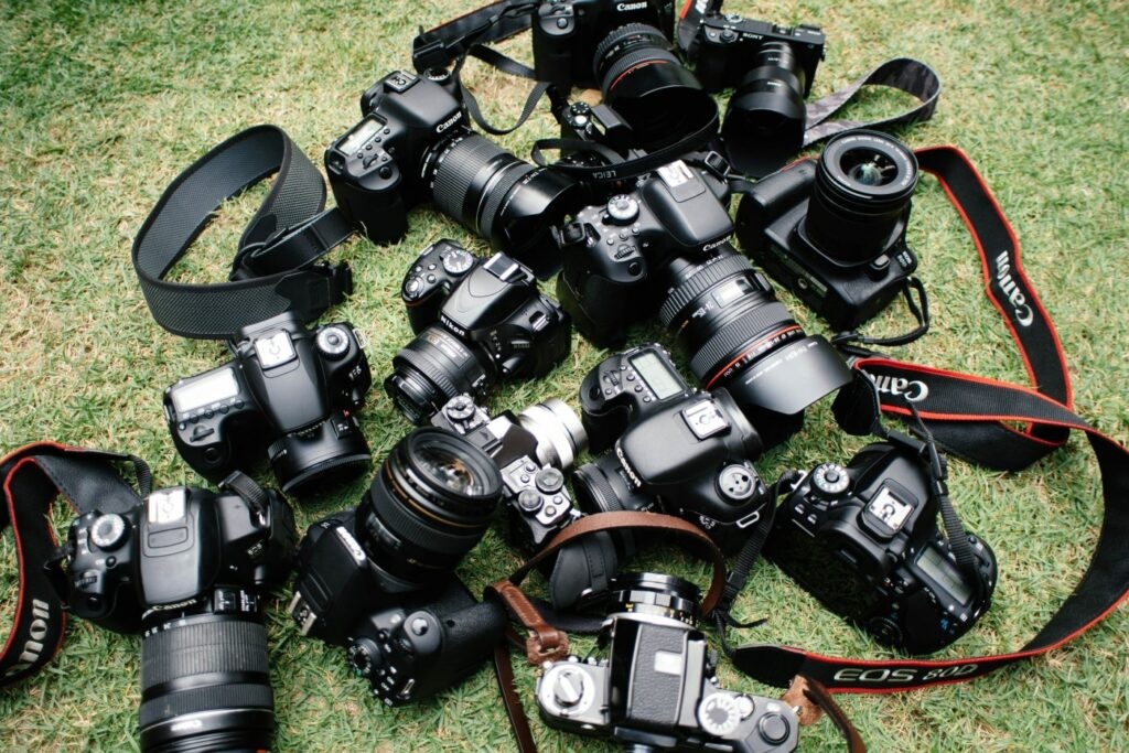 Many different camera types suitable for family photos arranged next to each other.